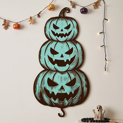 Stacked Jack-O-Lantern Halloween Garden Stake in a garden