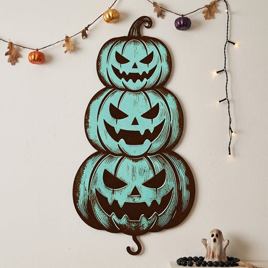 Stacked Jack-O-Lantern Halloween Garden Stake in a garden