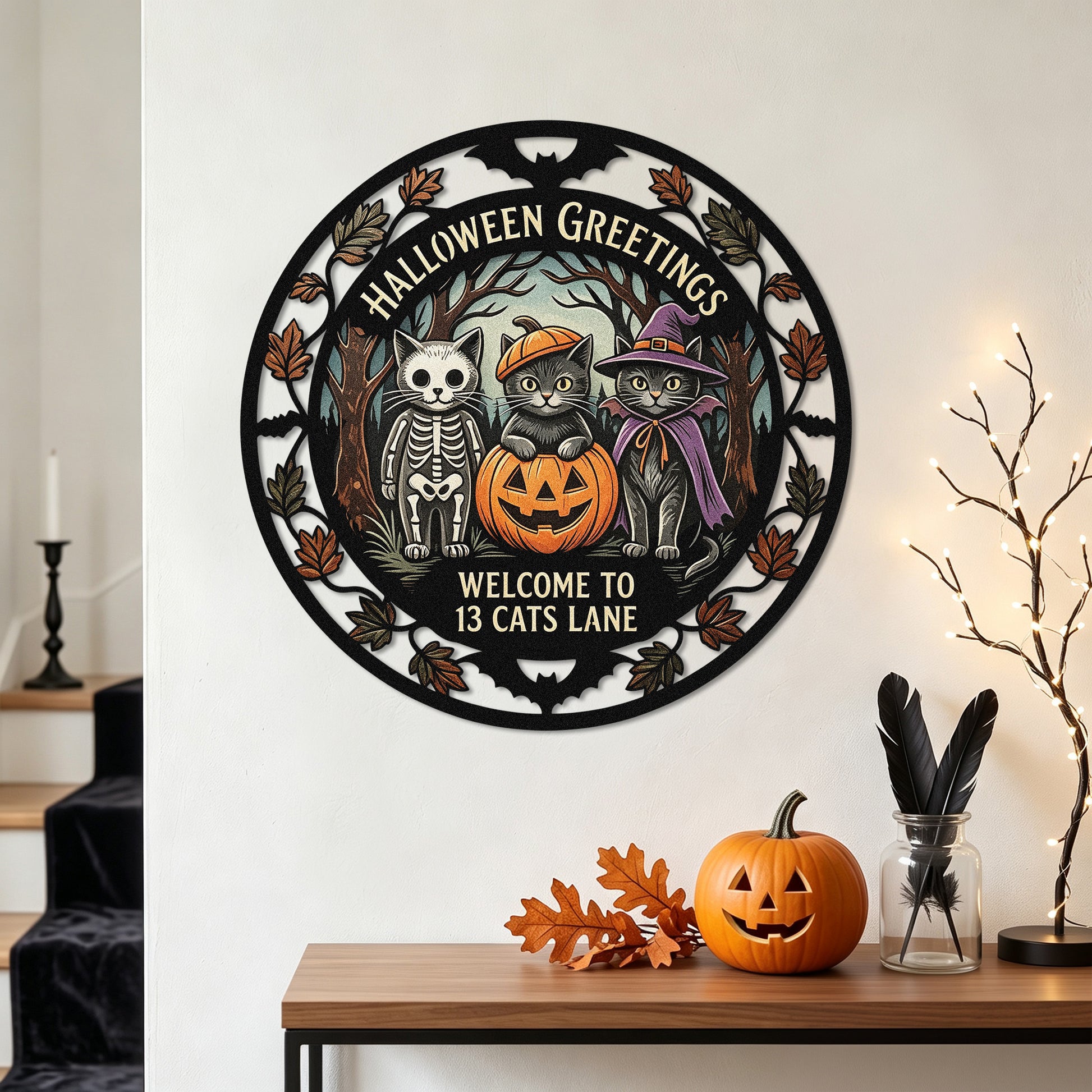 Costumed cats Halloween garden stake among pumpkins