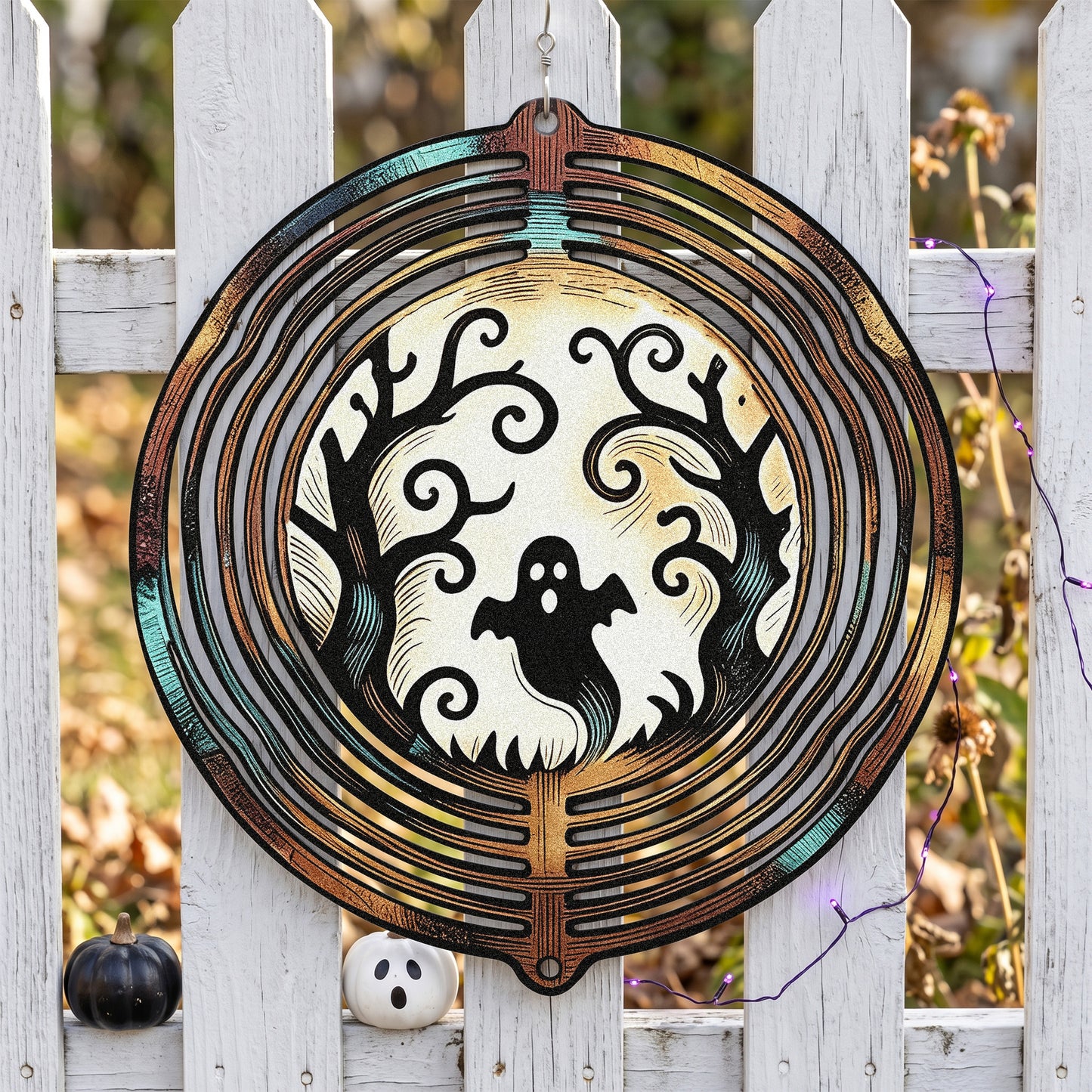 Ghost Moon Halloween Garden Spinner in a garden
